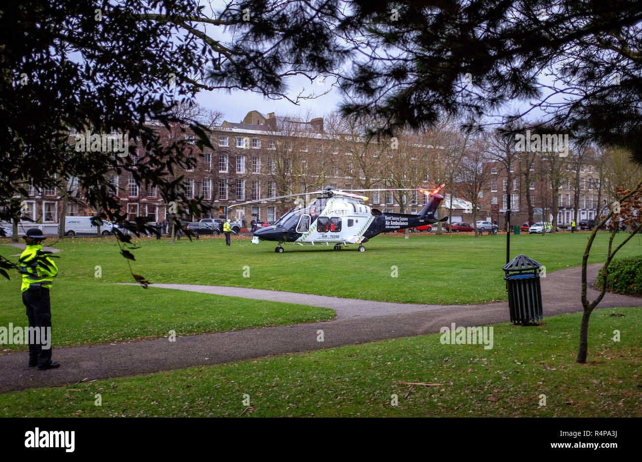 Worthing, Sussex, UK. 28th November 2018 - The Kent Surrey & Sussex Air Ambulance takes off from Steyne Gardens in Worthing after responding to a report of a man having fallen from a car park in Worthing . Police were alerted at the Guildbourne Centre car park by South East Coast Ambulance about 2.08pm on Wednesday (28 November). Credit: Simon Dack/Alamy Live News Stock Photo