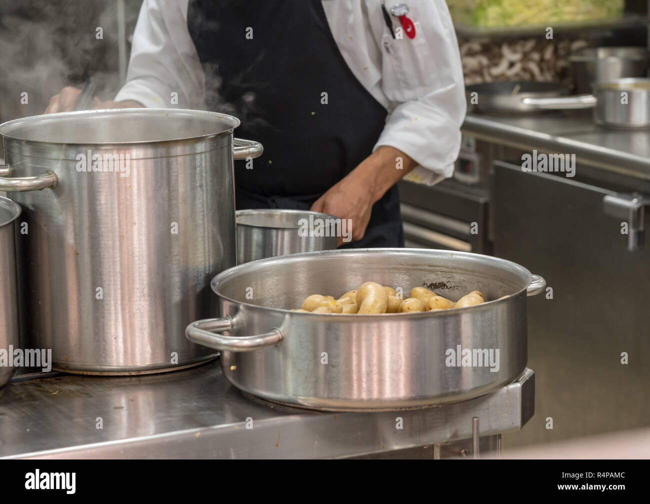 Modern stainless steel hobs in commercial kitchen Stock Photo Alamy