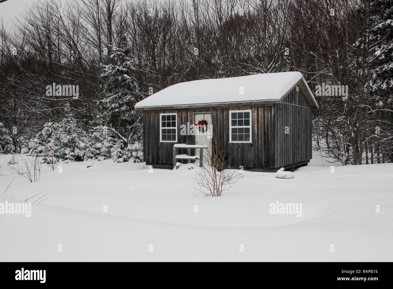 A small cabin in the woods of Cape Breton, Nova Scotia decorated for Christmas Stock Photo Alamy