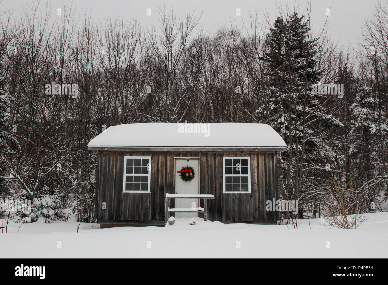 A small cabin in the woods of Cape Breton, Nova Scotia decorated for Christmas Stock Photo Alamy