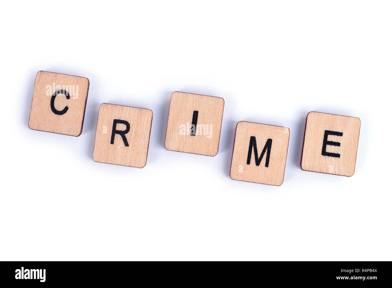 The word CRIME, spelt with wooden letter tiles. Stock Photo