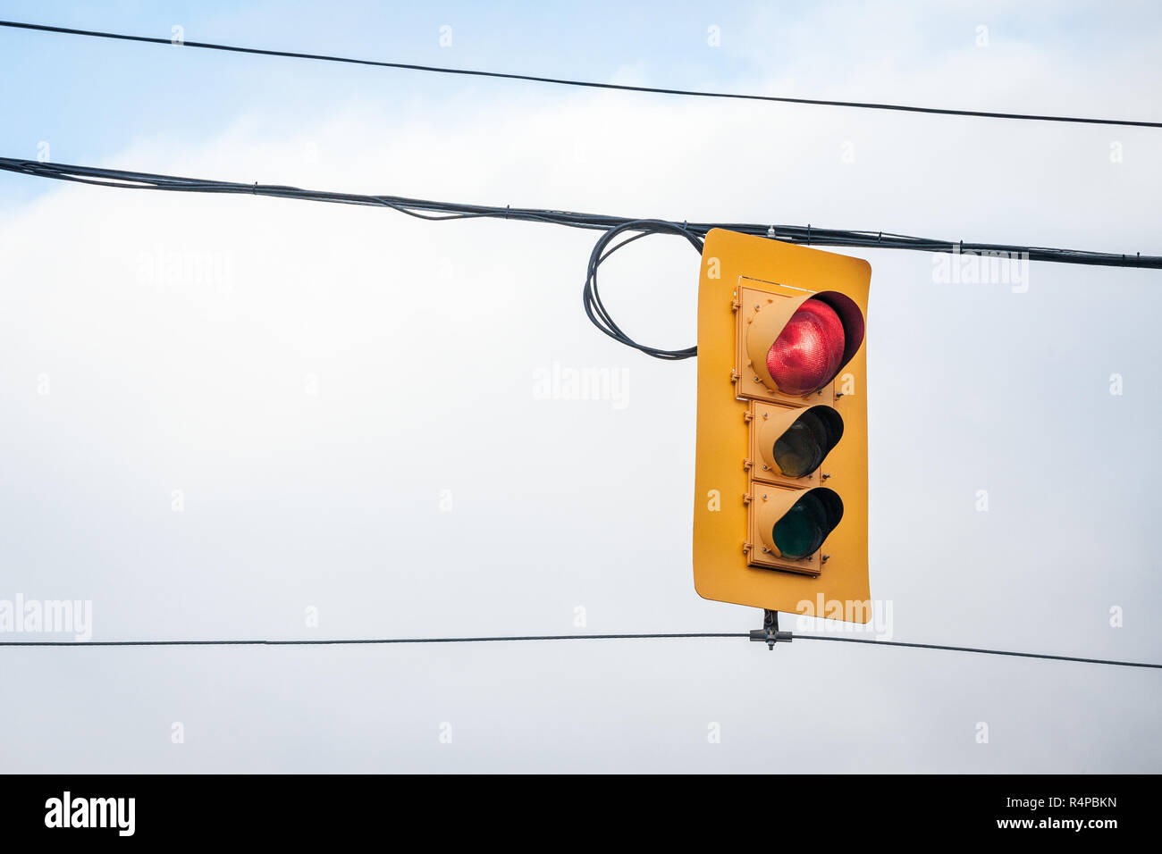 Traffic light abiding by American standard regulations taken at a crossroad in Ottawa, Ontario, Canada, indicating red light for cars  Picture of  an  Stock Photo