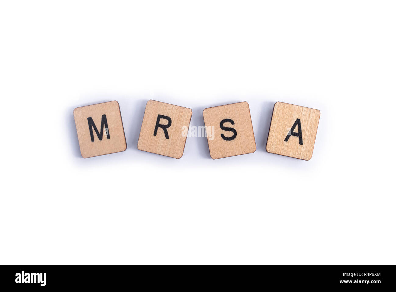 The abbreviation MRSA - Methicillin-resistant Staphylococcus aureus, spelt with wooden letter tiles. Stock Photo
