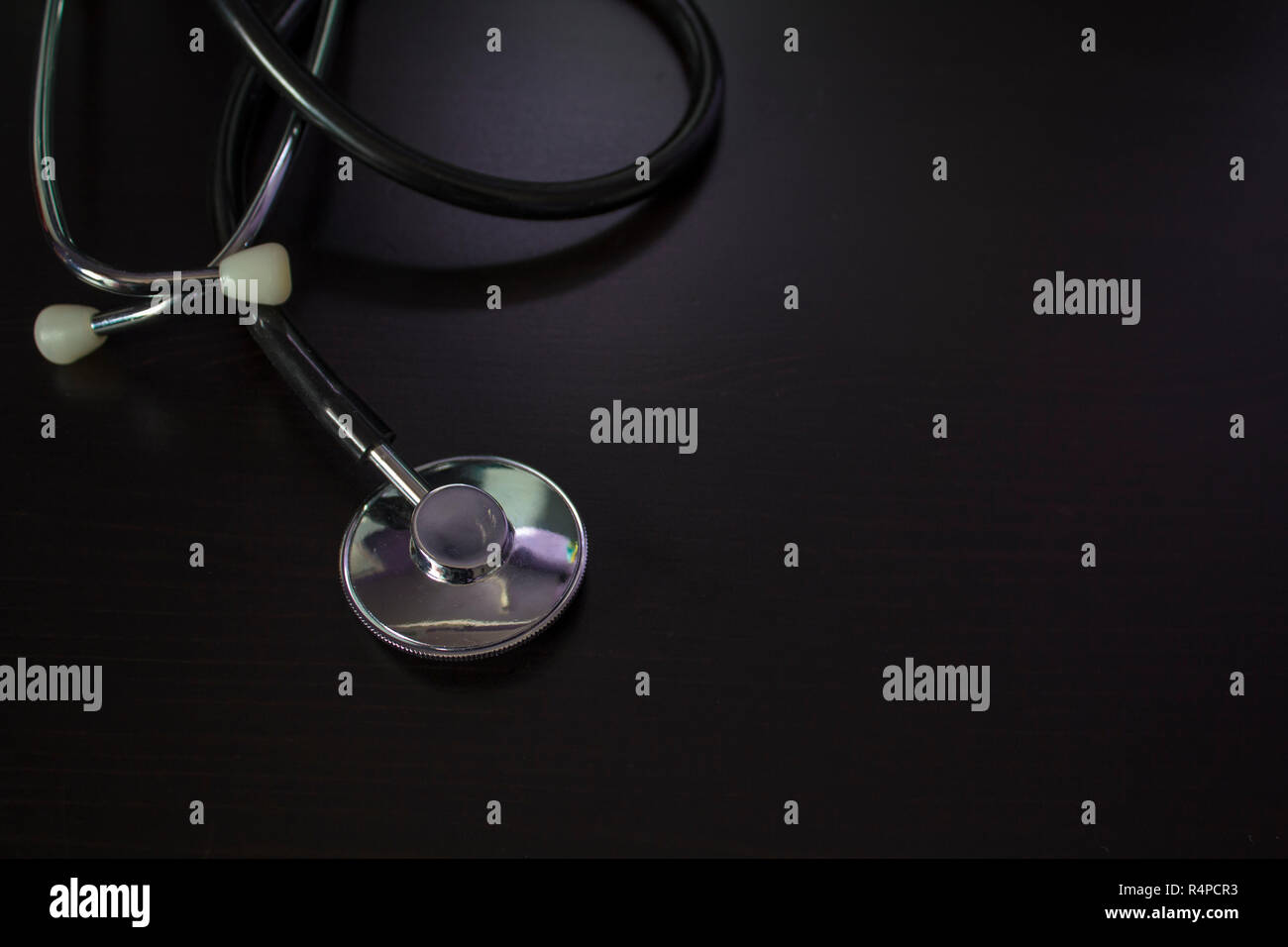 Black medical stethoscope wooden hi-res stock photography and images ...