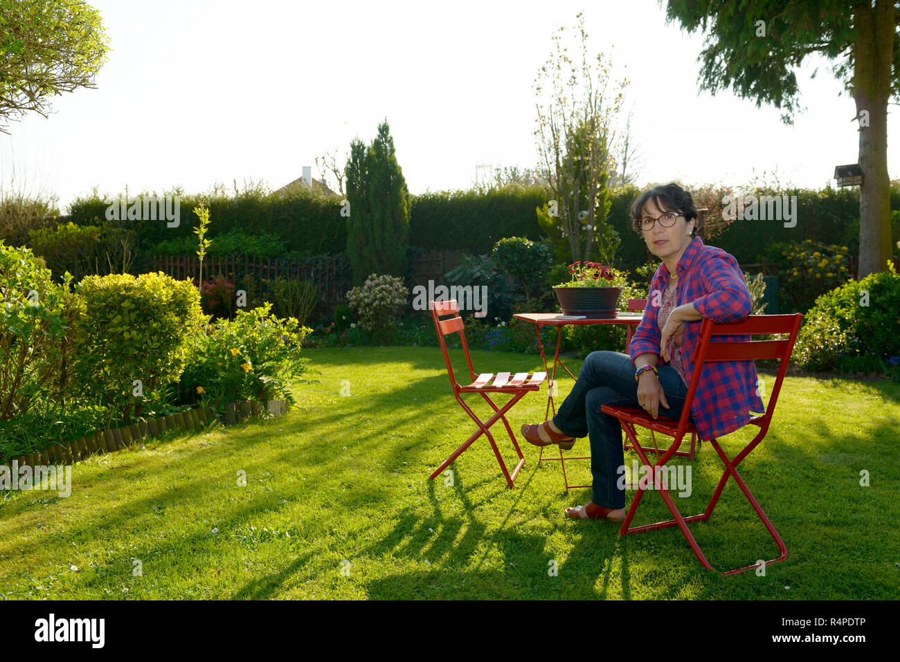 beautiful mature woman in the garden Stock Photo - Alamy
