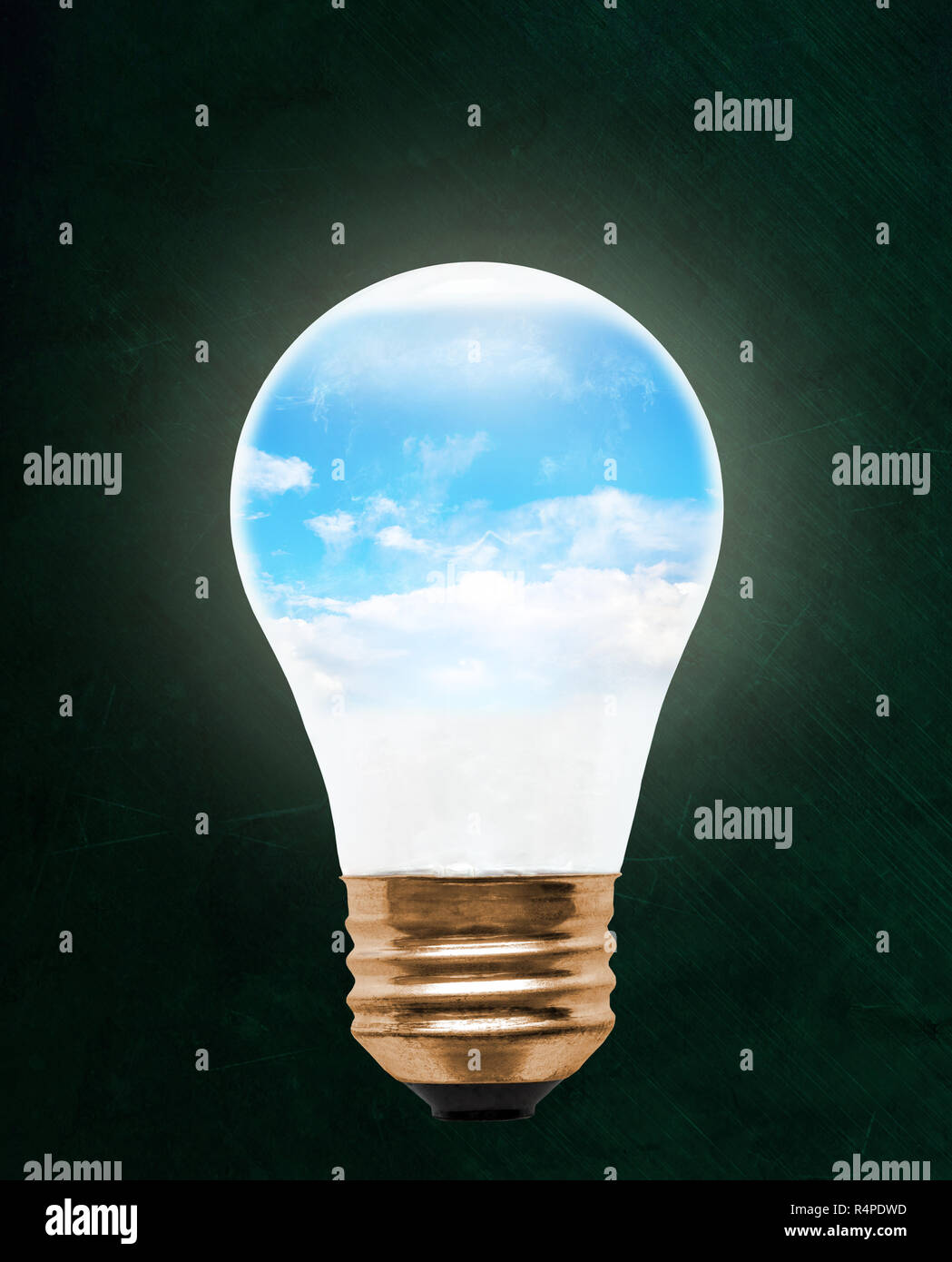 Blue sky inside floating light bulb with copy space. Concept of ecology, environmental conservation; green alternative. Stock Photo