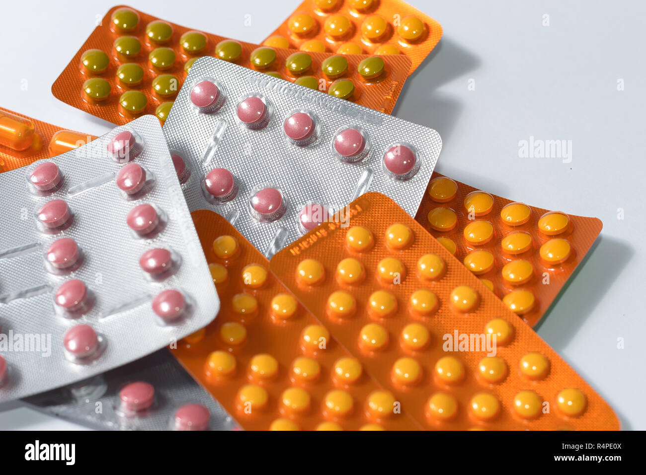 Pile of colorful tablets and capsules pills in blister packs. Global health care and drug use with reasonable concept copyspace Stock Photo