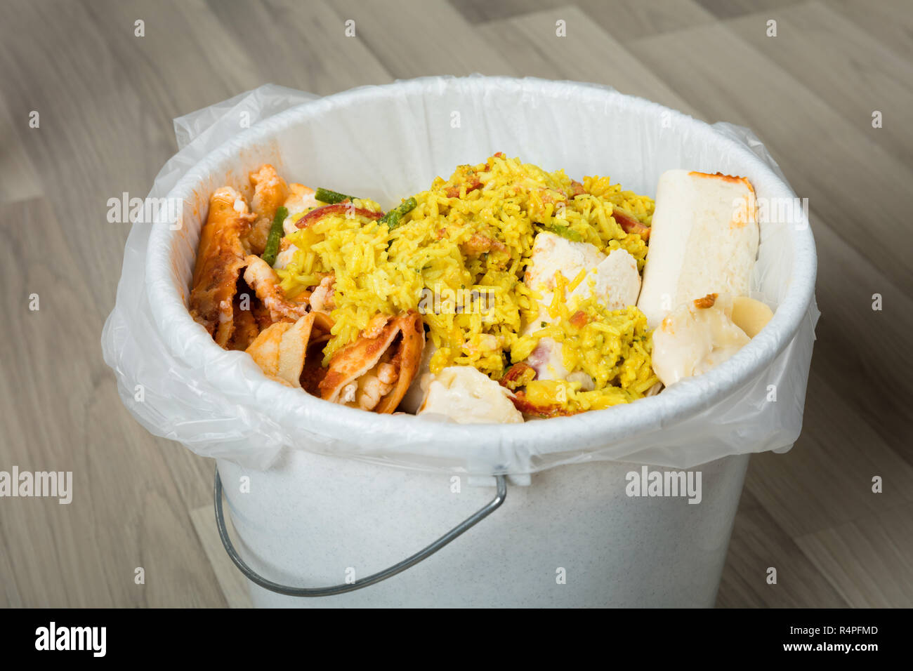 Leftover Food In Trash Bin Stock Photo