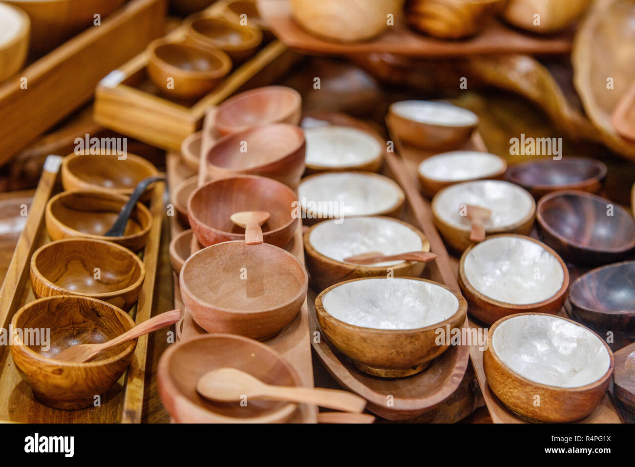 Sets of wooden bowls with spoons at a souvenir shop. Bali, Indonesia
