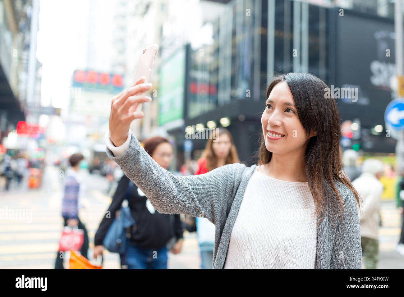 Woman taking selfie by cellphone in Mongkok at Hong Kong Stock Photo ...