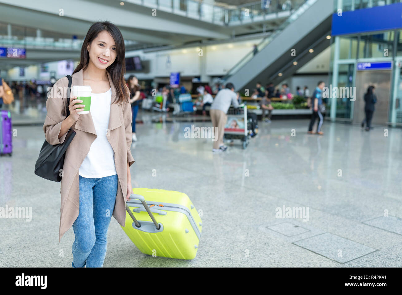 Woman go travel with luggage in Hong Kong international airport Stock