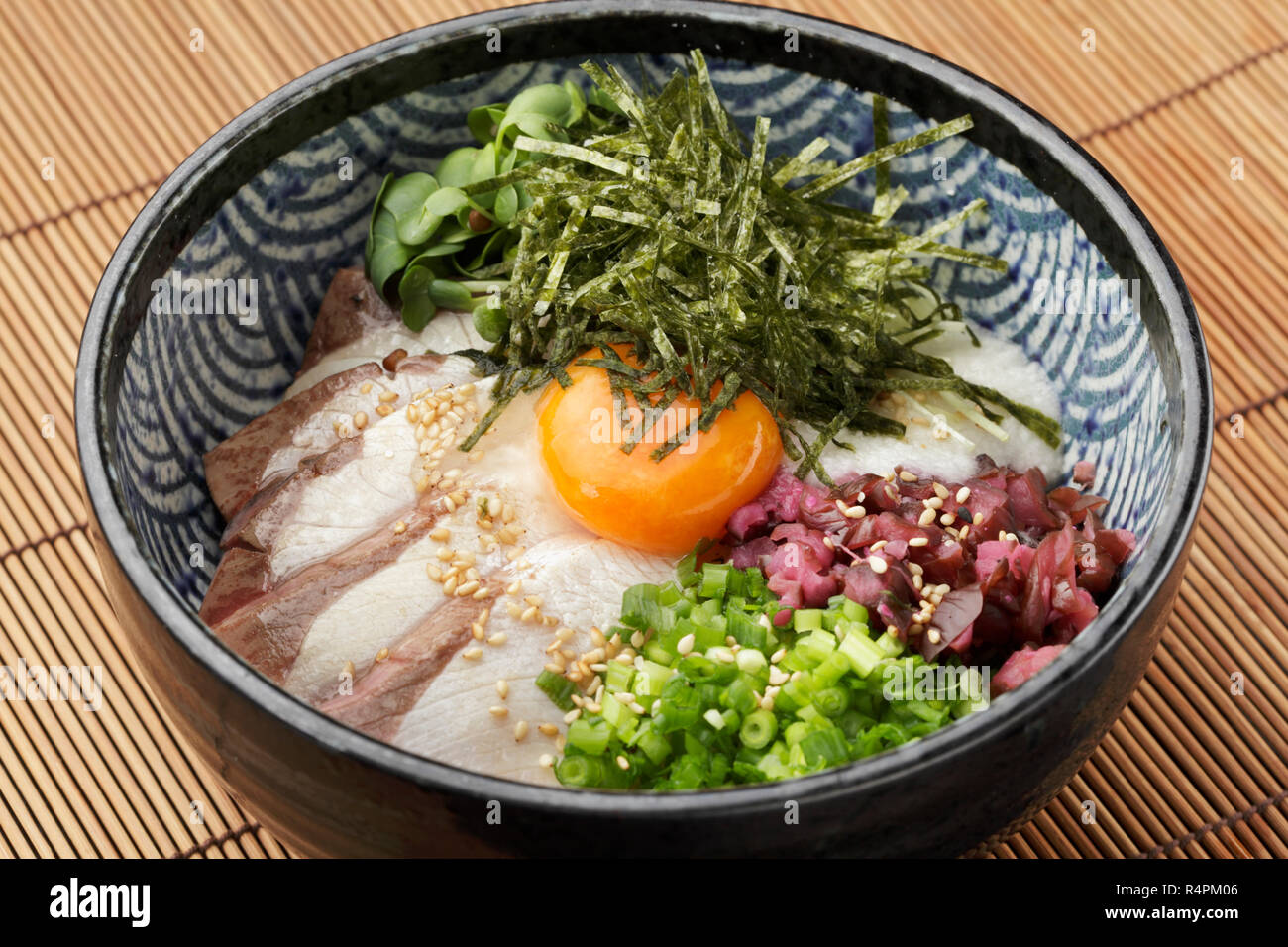 Bowl of ramen udon noodle with eeg, onion, pork and sprouts Stock Photo