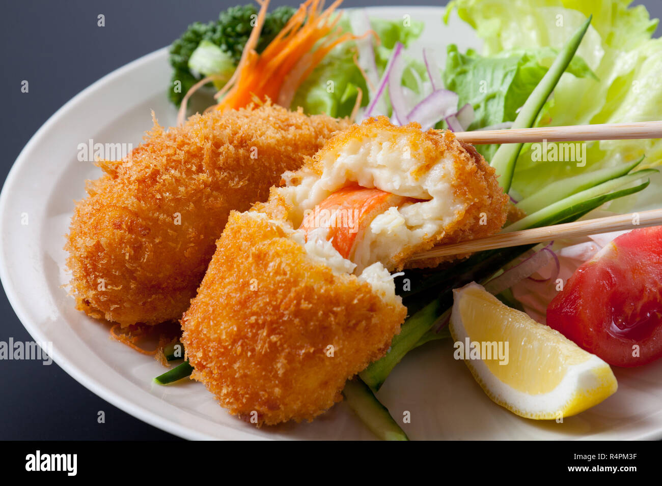Fried breaded crab meat with cheese on dish Stock Photo - Alamy