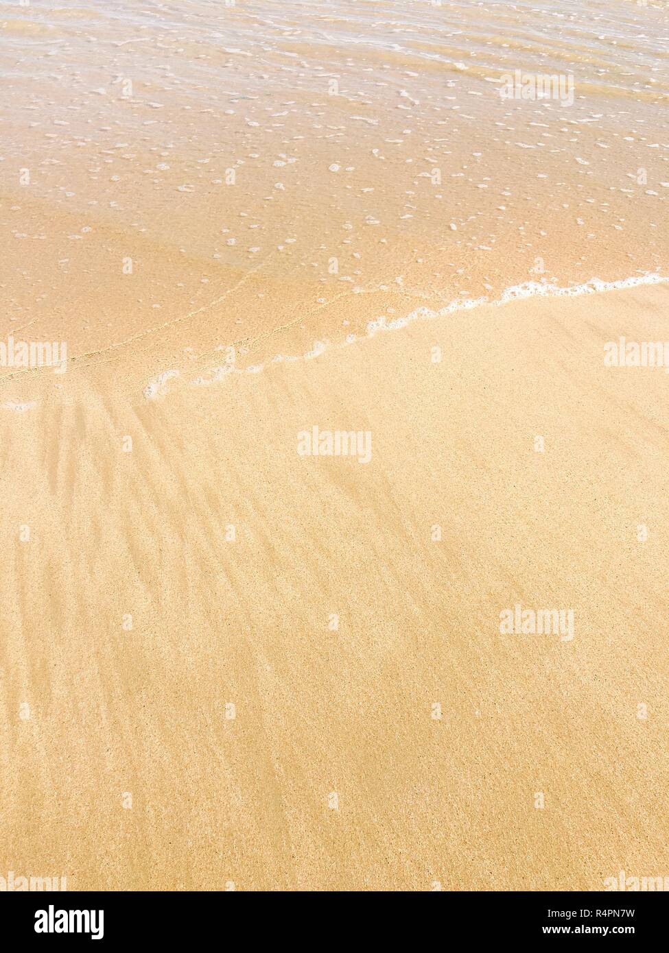 Waves reaching sea shore sunny hi-res stock photography and images - Alamy