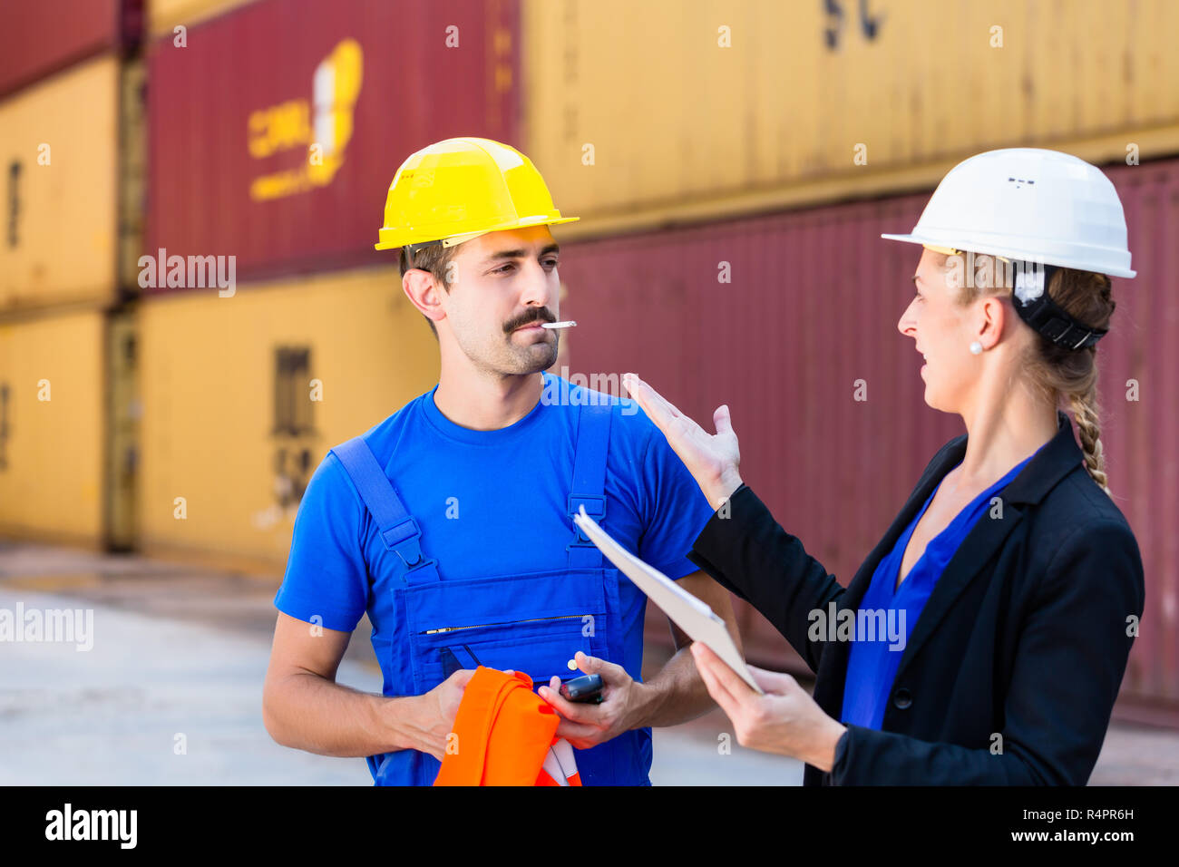 Smoking employee in port or container terminal Stock Photo