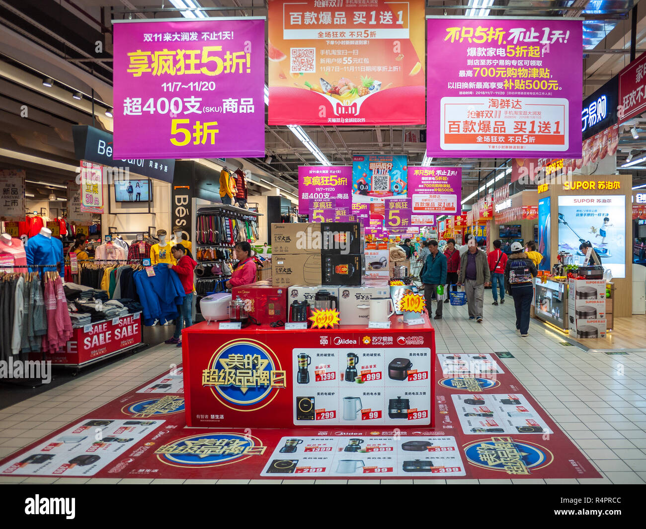 Interior of a modern supermarket with promotion advertisements all over the place. RT-mart, Liuzhou, China. Stock Photo