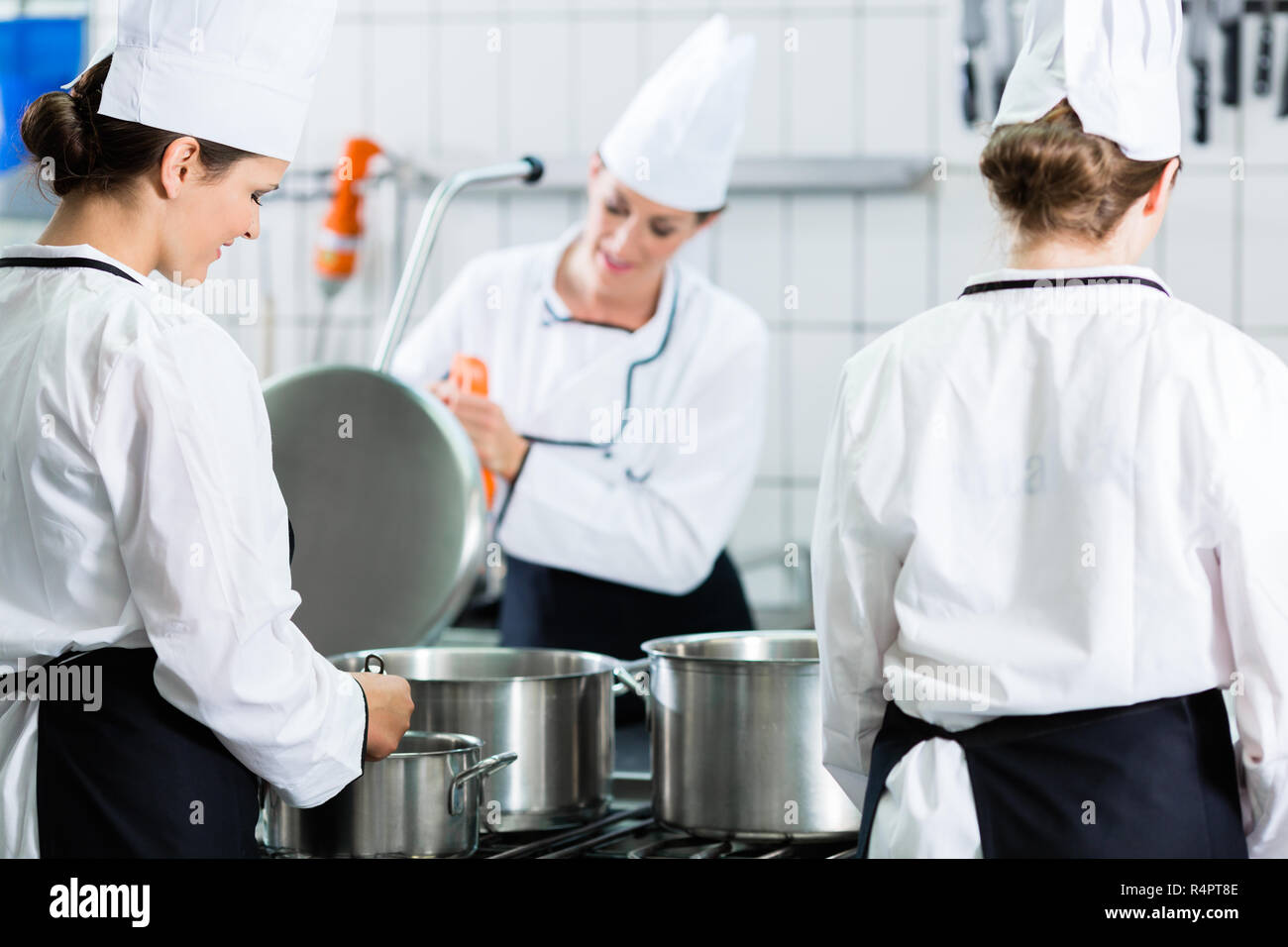 Canteen kitchen with chefs during service Stock Photo Alamy
