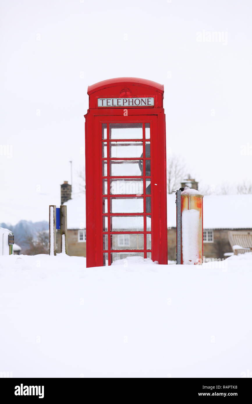 A K8 Red Telephone Box covered in snow at Goathland,North Yorkshire