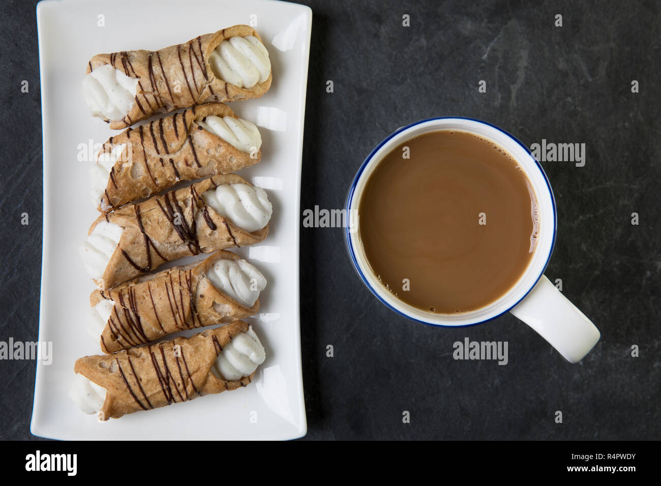 Cream Filled Pastries and Tea Stock Photo Alamy