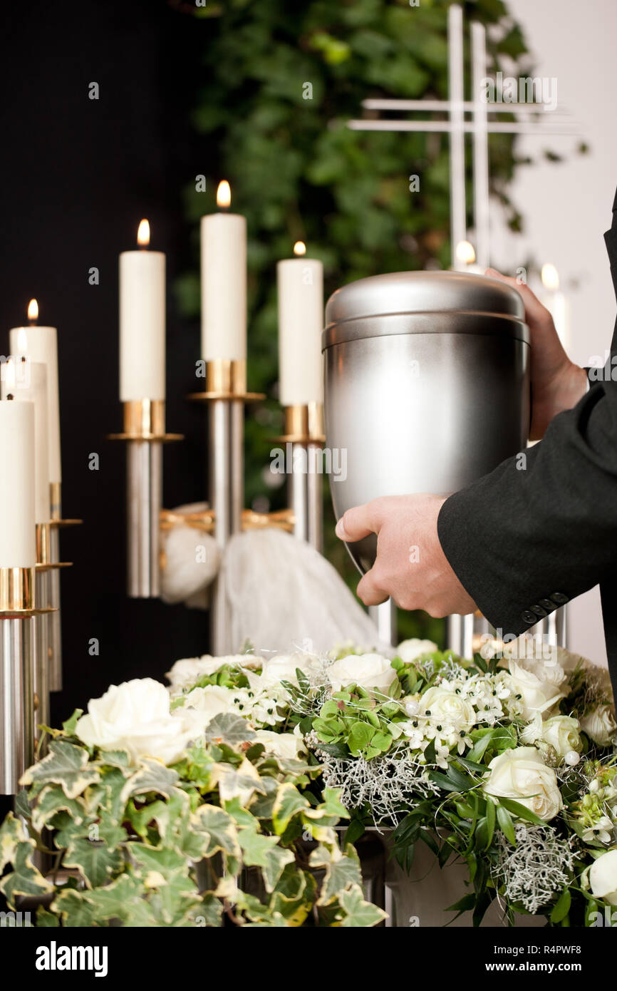 Grief - urn Funeral and cemetery Stock Photo