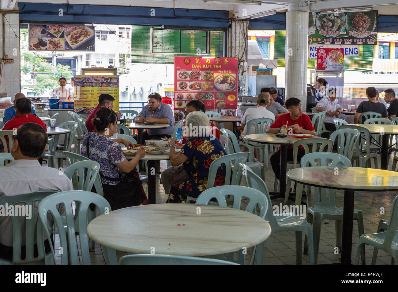 Individual Food Vendors Share Common Seating Area for Diners, Ipoh, Malaysia. Stock Photo