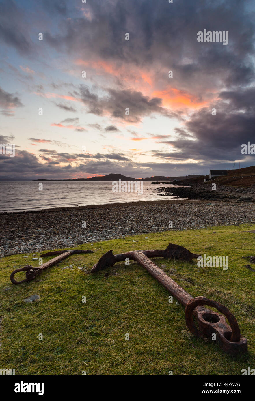 Old rusted anchors on the grass above the beach at Polbain, Coigach in the North-West Highlands of Scotland. Stock Photo