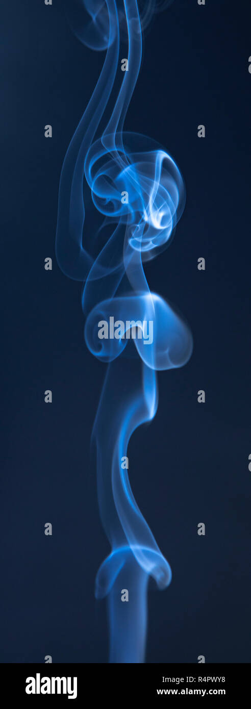 Abstract blue smoke swirls on dark background Stock Photo - Alamy