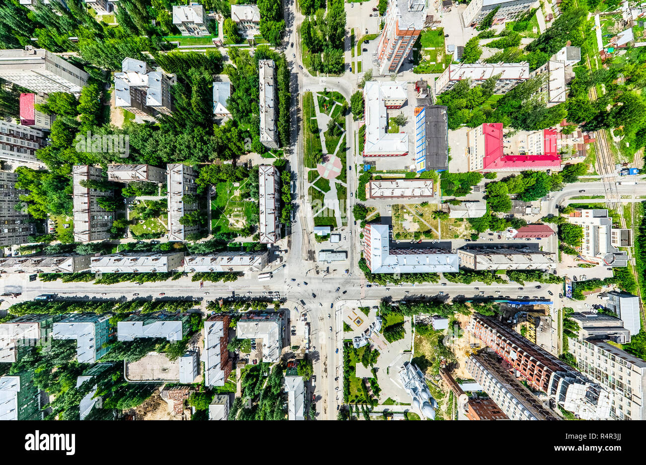 Aerial city view with crossroads and roads, houses, buildings, parks ...