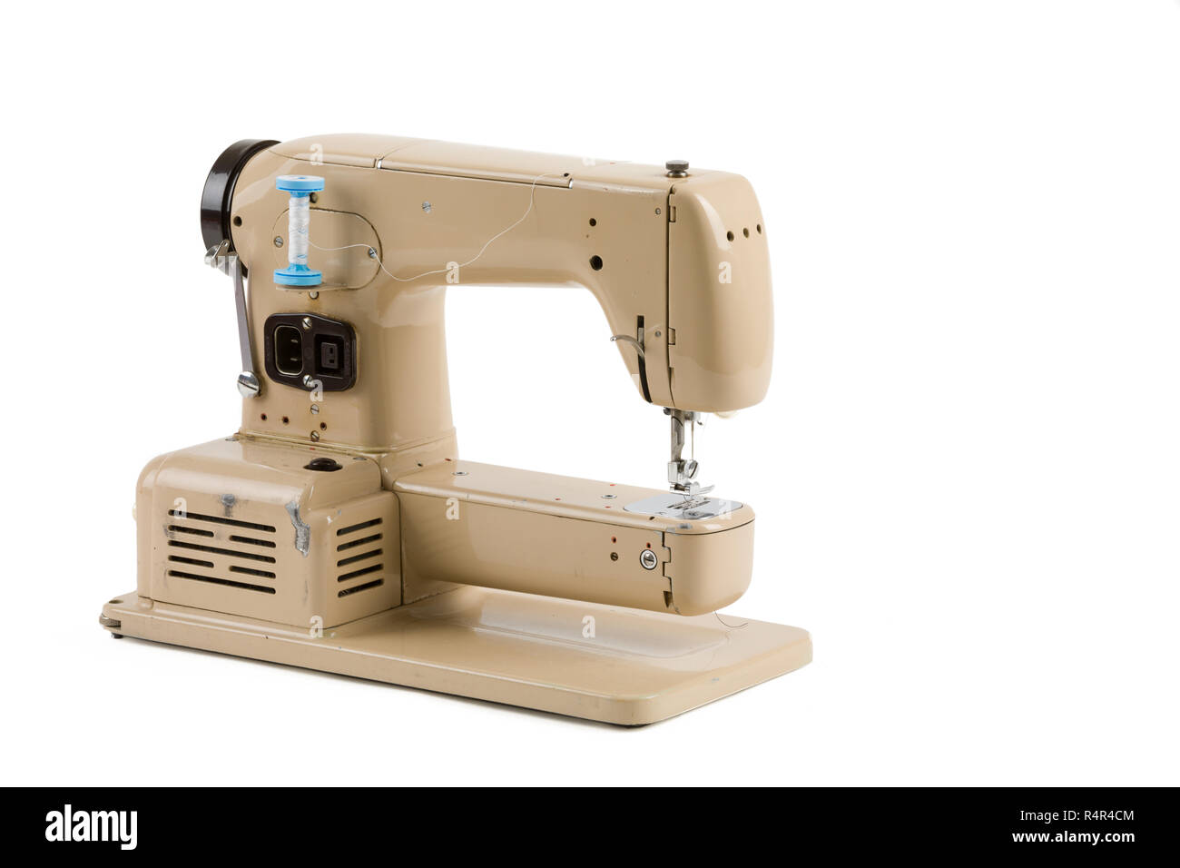 Old vintage sewing machine isolated on white Stock Photo - Alamy