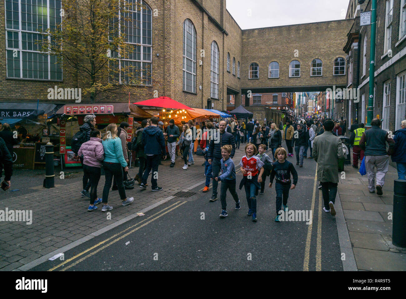 Brick Lane, East London on busy cold weekend afternoon Stock Photo
