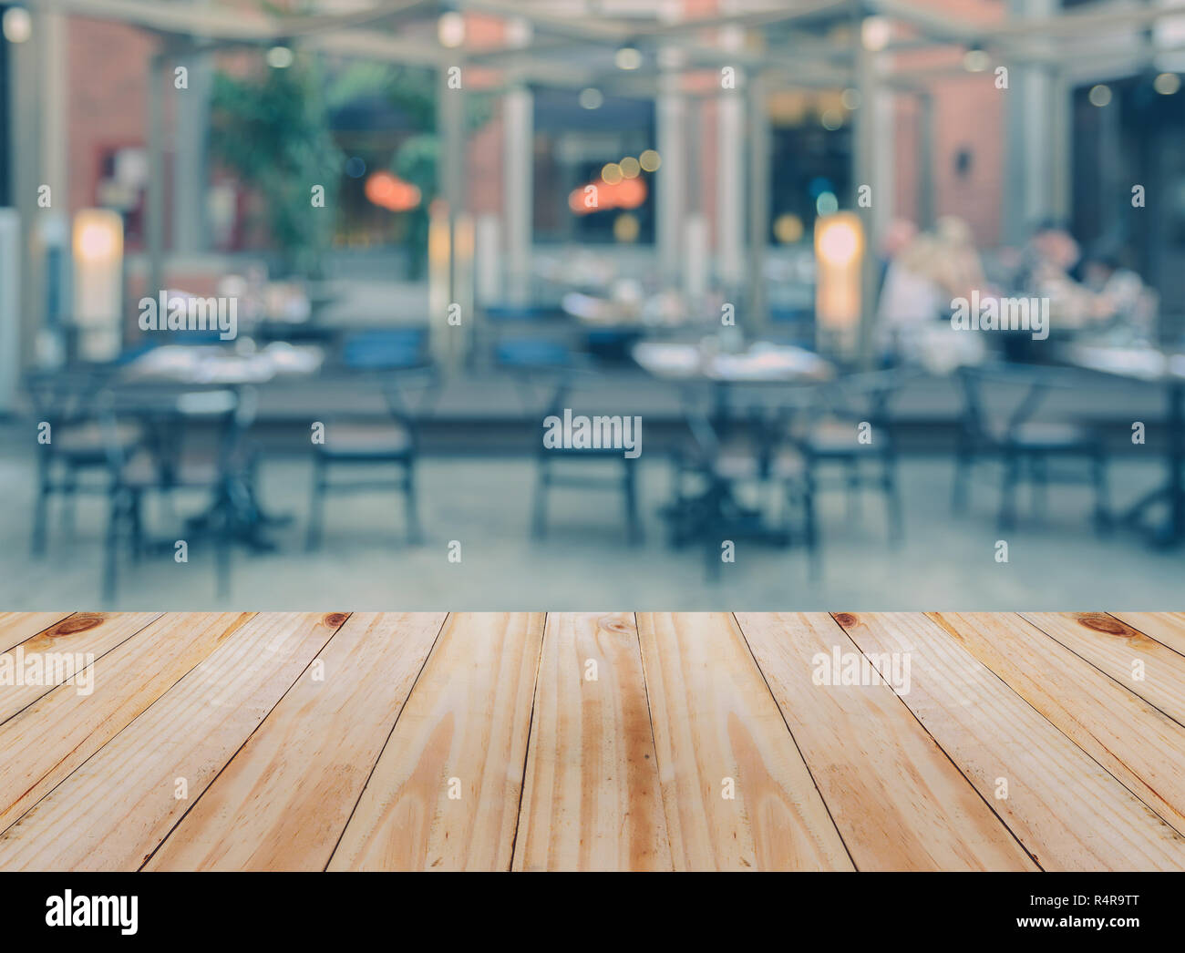 Empty wooden table with blurred restaurant background Stock Photo - Alamy