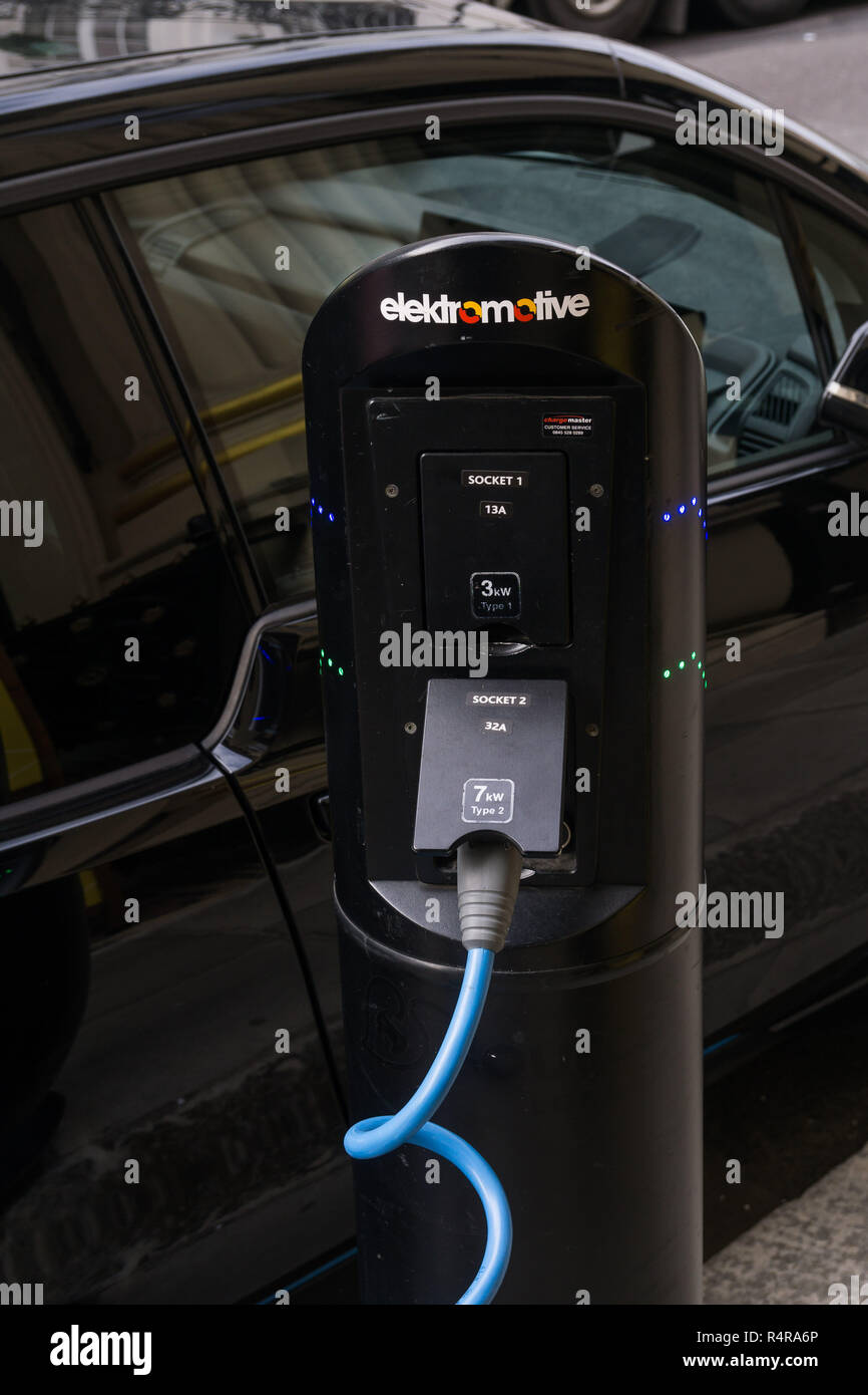 Electric cars charging on the street in London Stock Photo Alamy