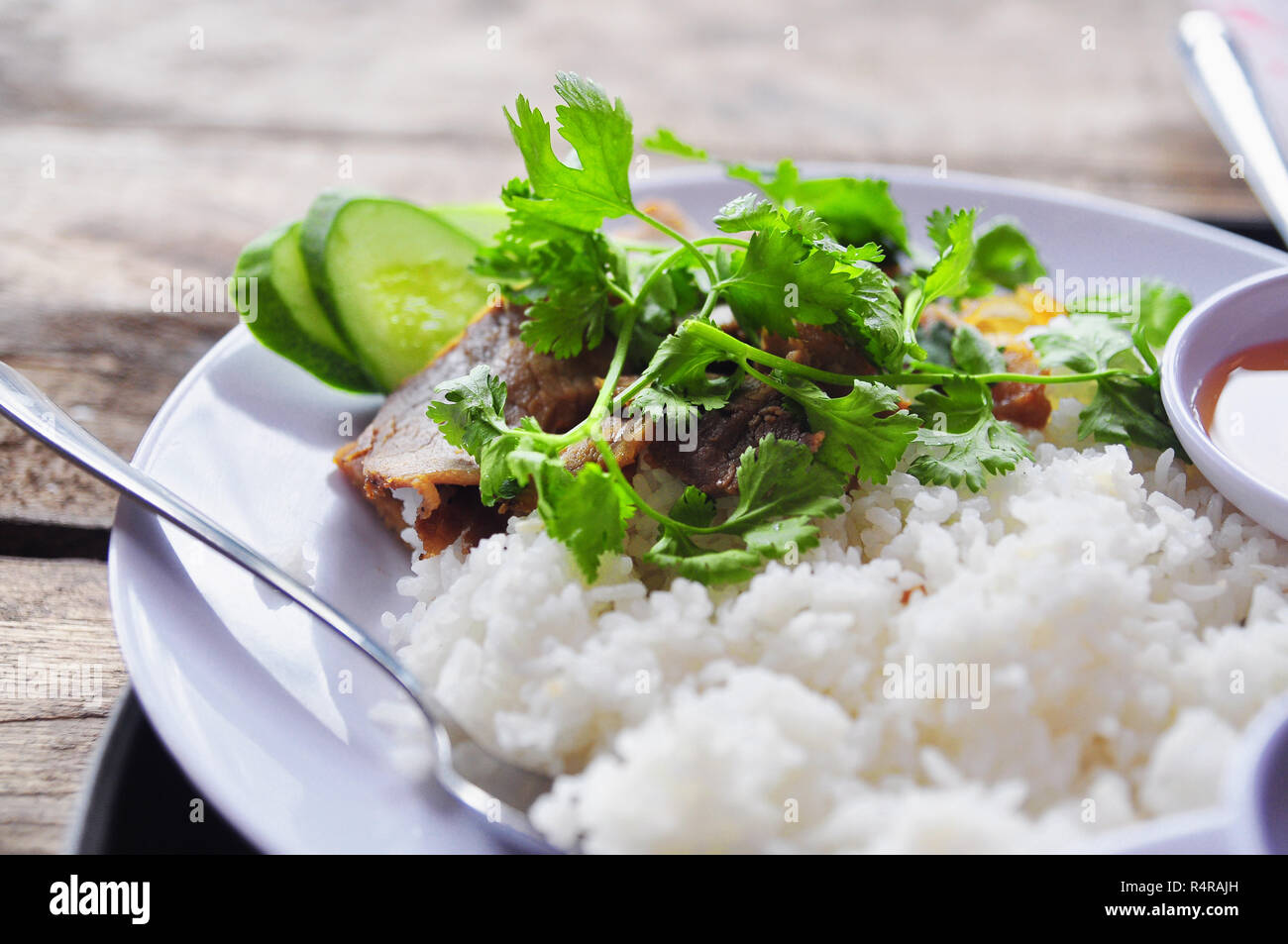 Vietnamese broken rice or com tam with fried chicken legs, pork and ...