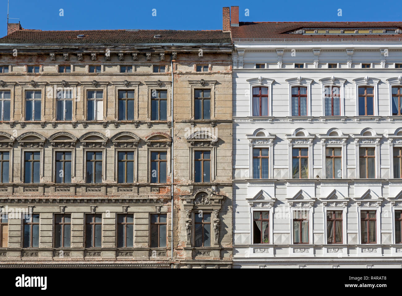 unrenovated and renovated historic house facade in gÃ¶rlitz,germany Stock Photo