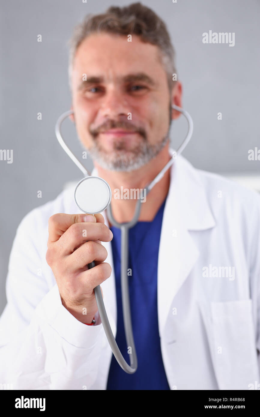 Smiling mature doctor phonendoscope hi-res stock photography and images ...