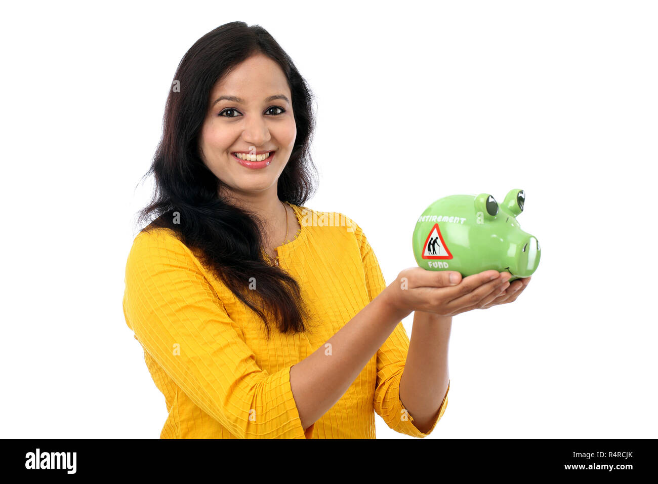 Young Indian Woman Saves Money in Piggy bank Stock Photo - Alamy