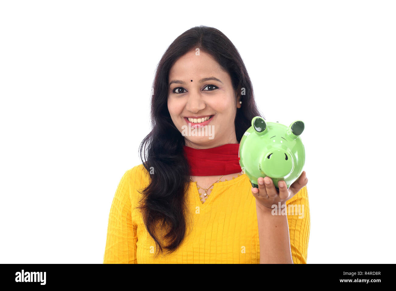 Young Indian Woman Saves Money in Piggy bank Stock Photo - Alamy