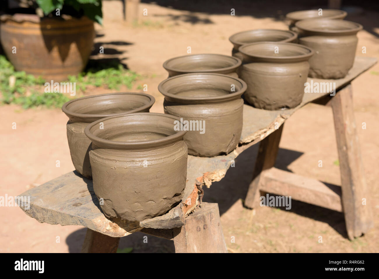 Drying wet handmade pots in sun to dry Stock Photo Alamy