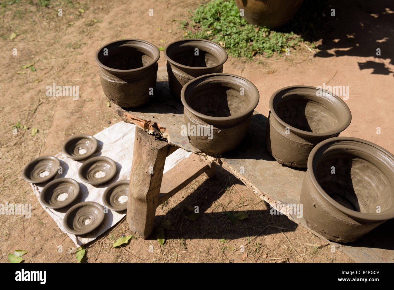 Drying wet handmade pots in sun to dry Stock Photo Alamy
