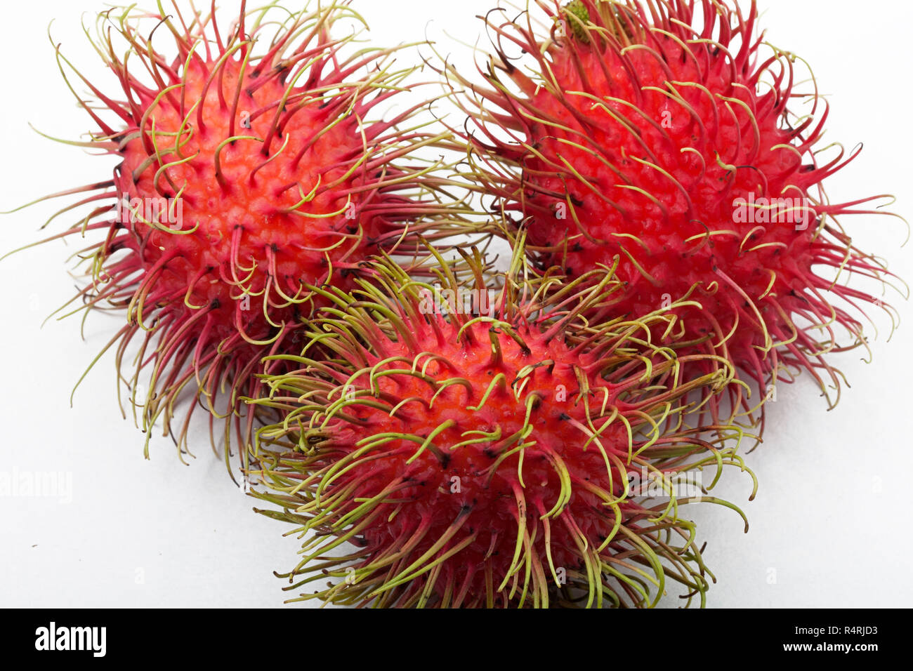 rambutan exotic fruit red color Stock Photo - Alamy