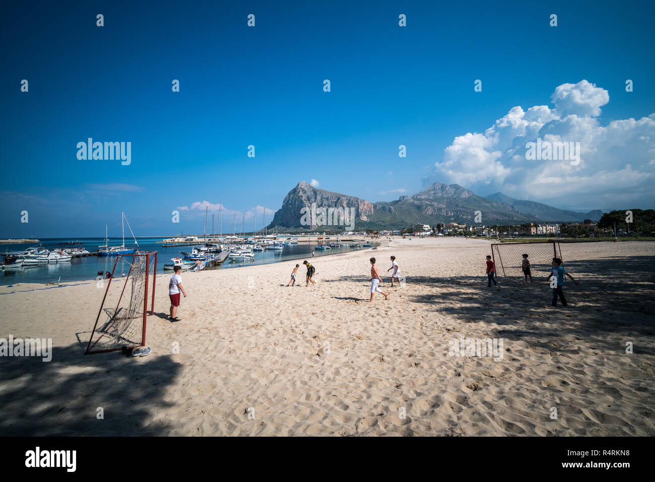 boys plaing football on the beach, San Vito Lo Capo, Sicily, Italy, Europe Stock Photo