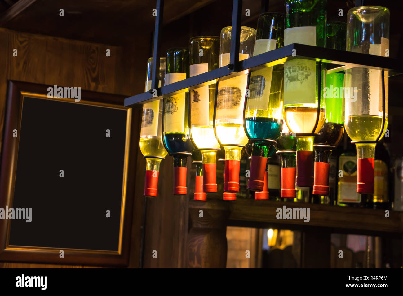 bottles of wine hanging in the bar Stock Photo Alamy