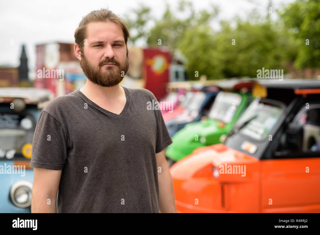Young bearded tourist man having vacation in Ayutthaya, Thailand Stock Photo