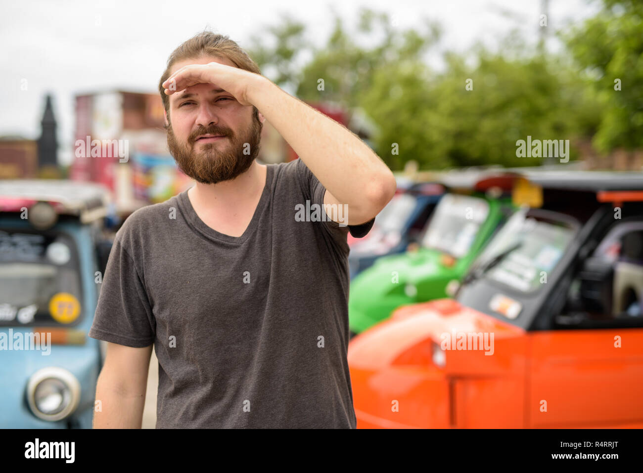 Young bearded tourist man having vacation in Ayutthaya, Thailand Stock Photo
