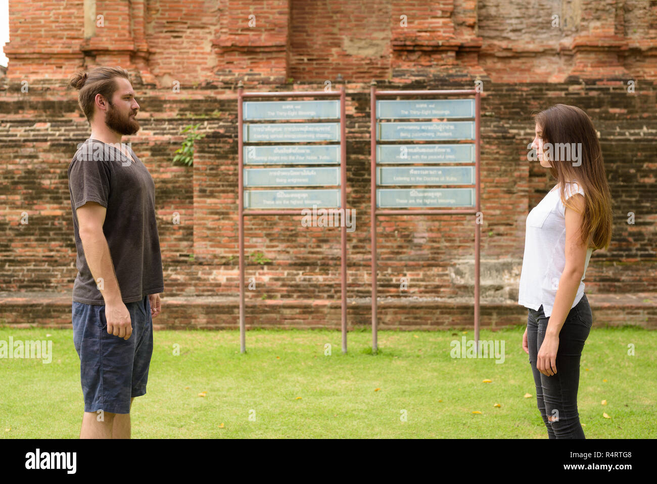 Young tourist couple having vacation together in Ayutthaya, Thai Stock Photo