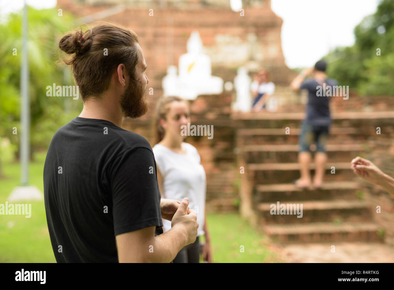 Young tourist couple having vacation together in Ayutthaya, Thai Stock Photo