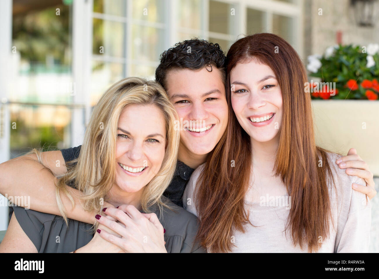 Portrait of a Latin mother and her teenage children. Stock Photo