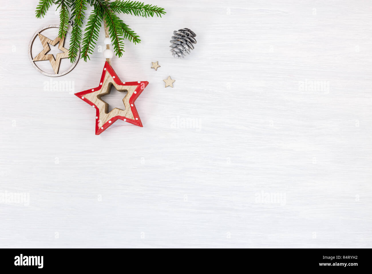 Green Fir Tree Branch And Hand Made Decorative Wooden Stars On