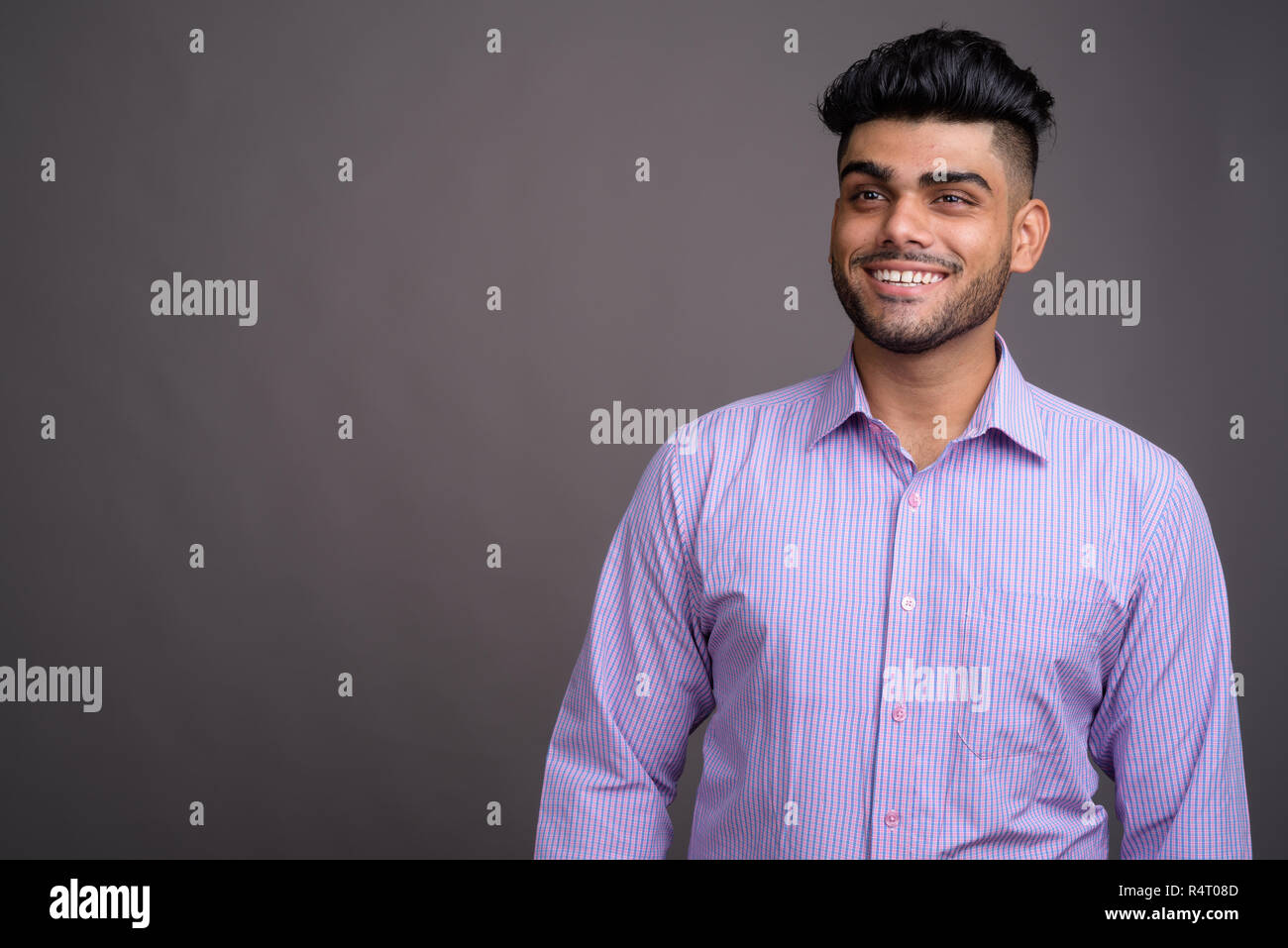 Happy young indian man thinking hi-res stock photography and images - Alamy
