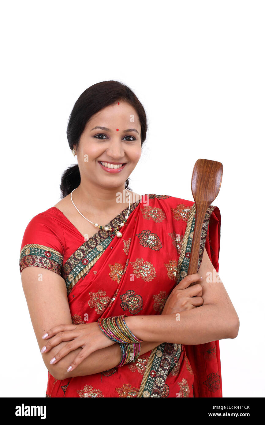Traditional Indian woman holding wooden ladle Stock Photo Alamy